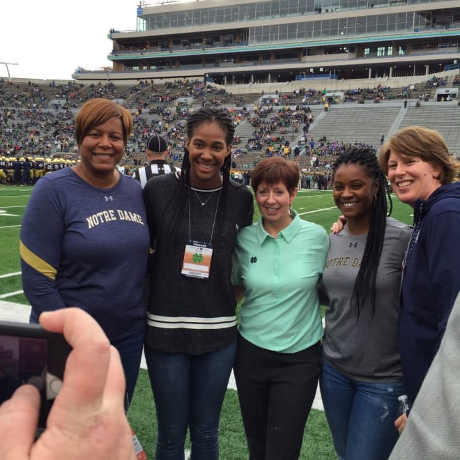 Patterson (second to left) with Notre Dame's coaching staff during a visit to the football game with Miami on Oct. 29. 