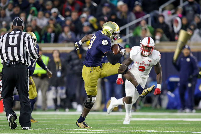 Josh Adams rushed for 202 yards while Notre Dame had a 318-50 advantage in the ground attack.