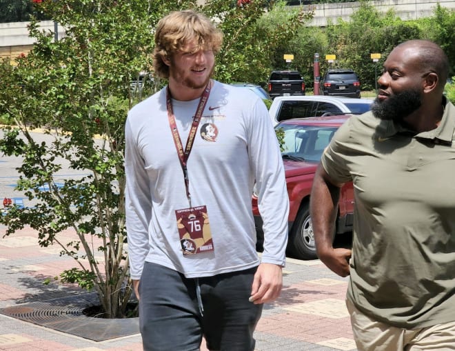 It was all smiles for offensive line prospect Luke Burgess and FSU offensive coordinator Alex Atkins during Burgess' official visit.