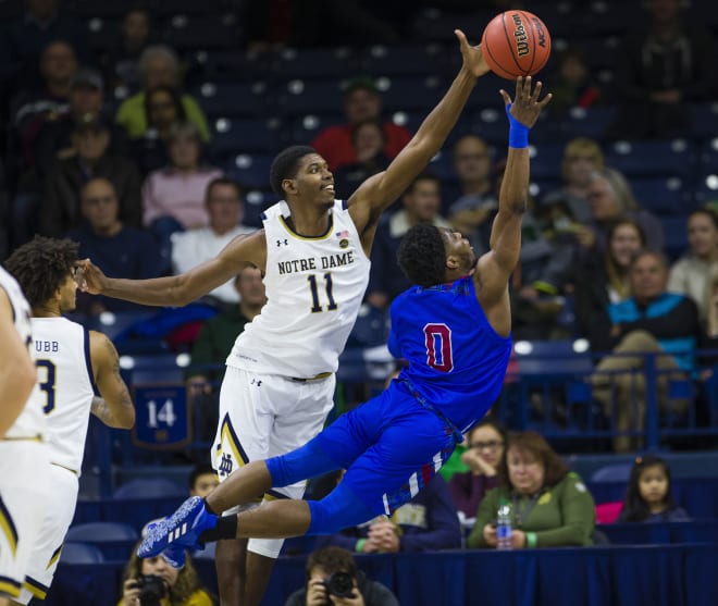 Notre Dame's Juwan Durham (11) blocks Presbyterian's Chris Martin (0) from shooting during an NCAA college basketball game Monday, Nov. 18, 2019, in South Bend, Ind.
