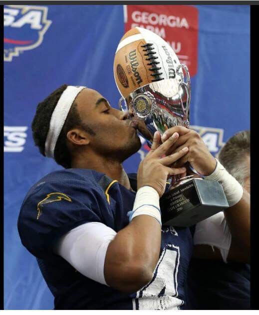 Rivals 2-star RB Trevor Gear displaying state championship trophy