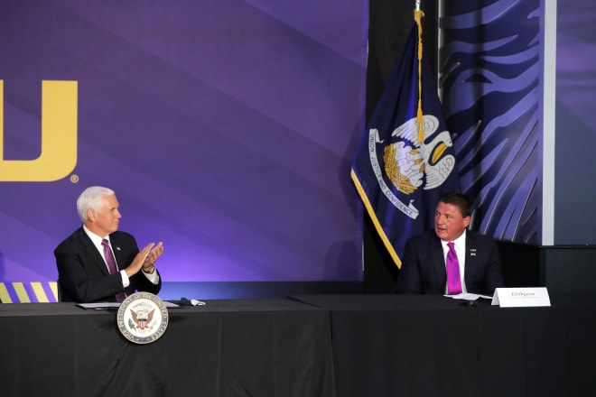 Years from now, when people look at this photo of the vice-president of the United States applauding Ed Orgeron months before Orgeron was featured on 60 Minutes, they'll say, "Holy hell, 2020 was wild, man!"