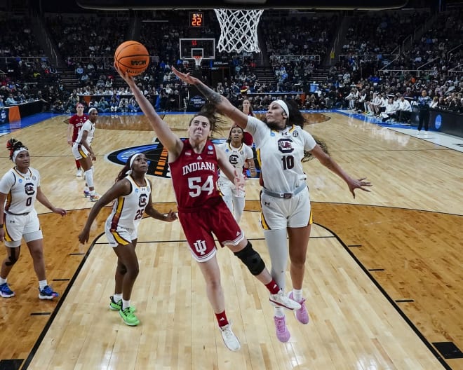 Mar 29, 2024; Albany, NY, USA; Indiana Hoosiers forward Mackenzie Holmes (54) shoots a layup against South Carolina Gamecocks center Kamilla Cardoso (10) during the second half in the semifinals of the Albany Regional of the 2024 NCAA Tournament at the MVP Arena. Mandatory Credit: Gregory Fisher-USA TODAY Sports