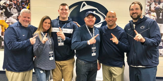 Zinter and his family pose with multiple members of Penn State's coaching staff during his visit in November.