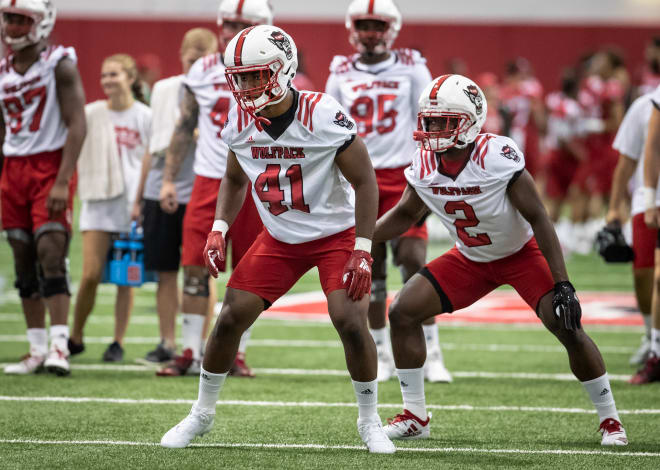 Moore (41) and Acceus (2) return at middle linebacker for NC State.