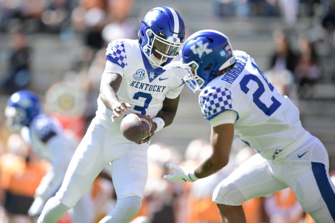 Kentucky RB Chris Rodriguez Jr. (right) takes the handoff from Terry Wilson. 