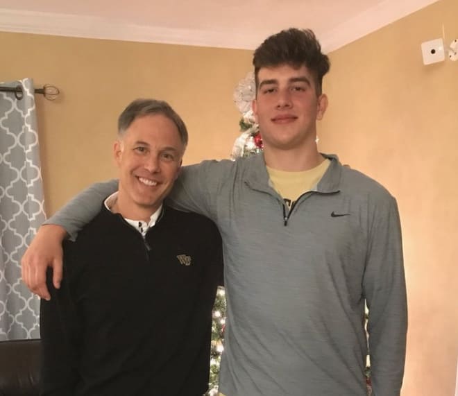 Whiteheart poses with coach Clawson during an in-home visit in late November 