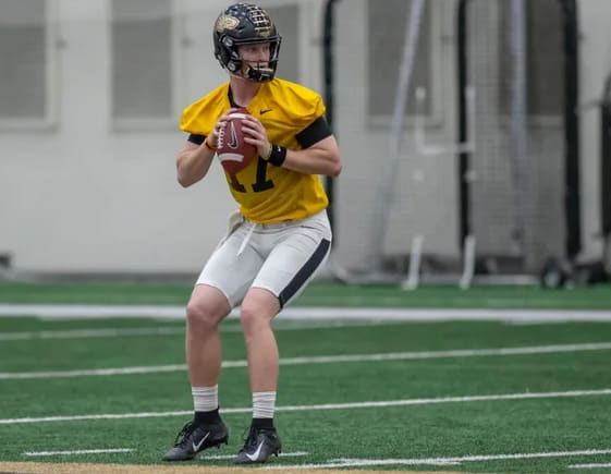 Purdue quarterback Nick Sipe drops back to pass during practice