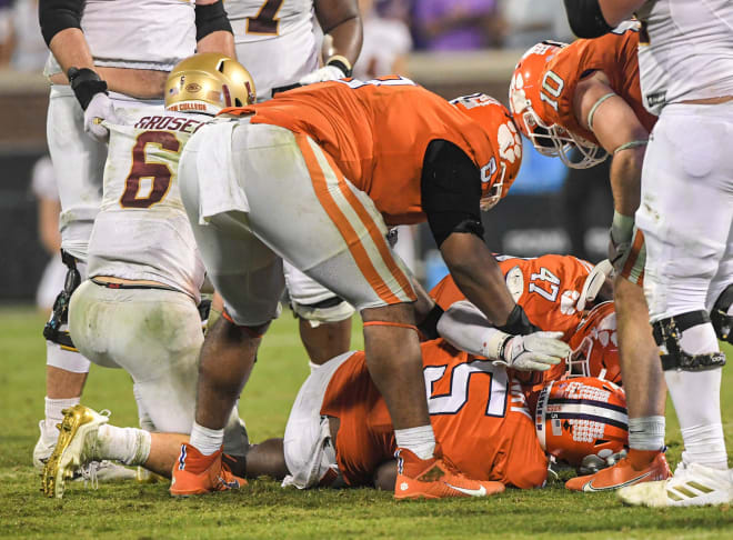 Dennis Grosel is picked up by his offensive line after Clemson defensive end KJ Henry recovered the game-winning fumble last season (Photo: Ken Ruinard / staff / USA TODAY NETWORK).
