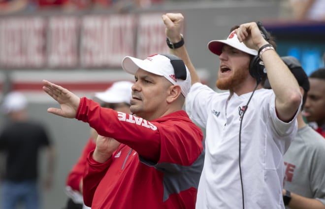 Gibson (red shirt) was previously the defensive coordinator at West Virginia.