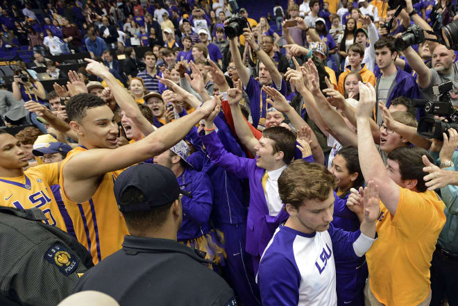 LSU forward Ben Simmons, second from left, celebrates with fans in the student section after their 76-71 win over Texas A&M