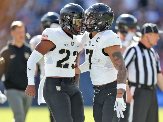 Linebackers Chance.Keith (#23) and Jimmy Ciarlo (#7) celebrates a defensive stop during the 1st.half against the Air Force Falcons