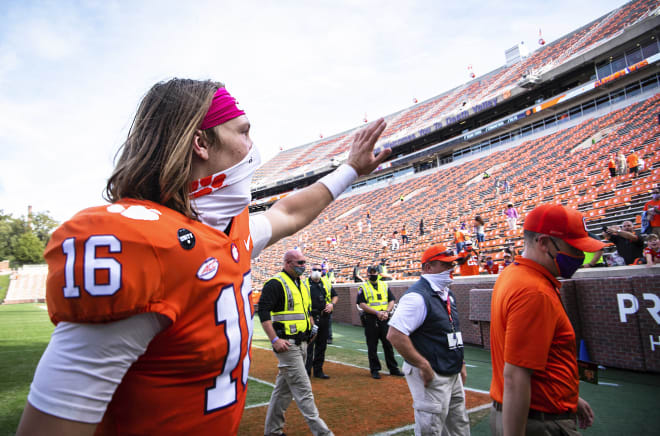 Clemson quarterback Trevor Lawrence waves to several fans in the stands at Death Valley following the Tigers' 47-21 win over Syracuse Saturday.