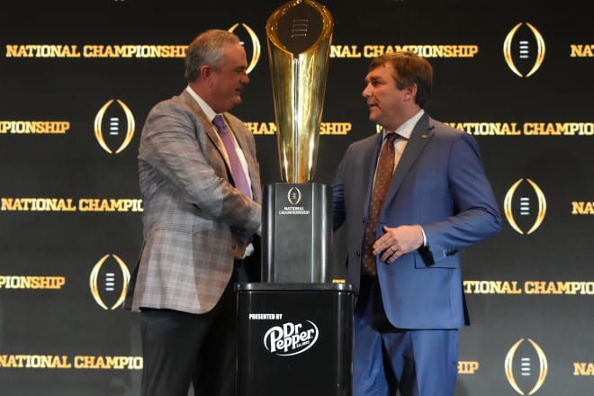 TCU Horned Frogs coach Sonny Dykes (left) and Georgia Bulldogs coach Kirby Smart pose with trophy at the 2023 CFP National Championship head coaches press conference at the Los Angeles Airport Marriott. Mandatory Credit: Kirby Lee-USA TODAY Sports