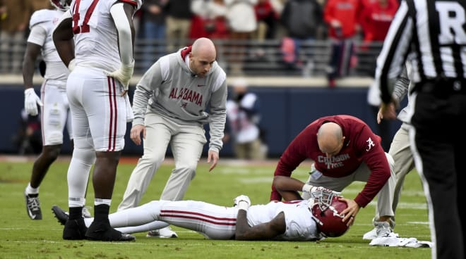 Alabama trainers converge on Alabama defensive back Eli Ricks (7) after he was injured on a tackle at Vaught-Hemingway Stadium. Photo |  Gary Cosby Jr.-USA TODAY Sports