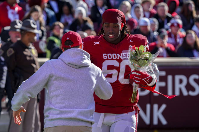 Brent Venables greets Tyler Guyton on senior day