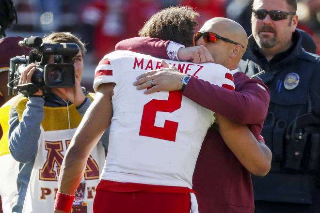 QB Adrian Martinez and PJ Fleck. 