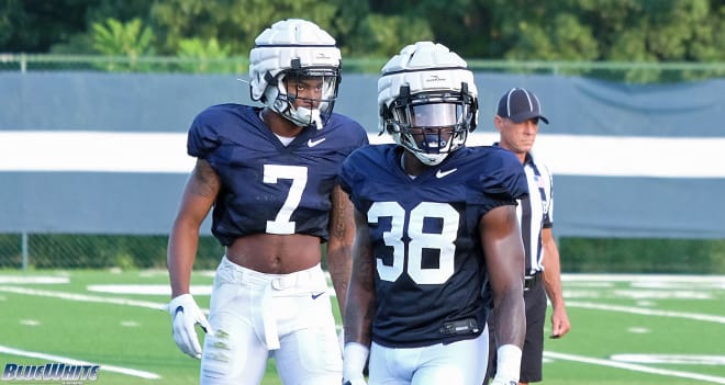Jaquan Brisker (left) and Wade are battling for the starting strong safety position. 