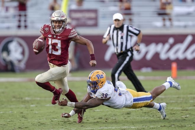 FSU quarterback Jordan Travis breaks free for a touchdown against Pitt.