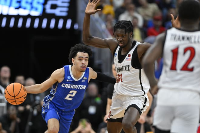 Mar 26, 2023; Louisville, KY, USA; Creighton Bluejays guard Ryan Nembhard (2) drives to the basket against San Diego State Aztecs forward Nathan Mensah (31) during the second half at the NCAA Tournament South Regional-Creighton vs San Diego State at KFC YUM! Center. 