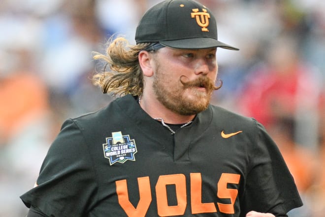 un 16, 2024; Omaha, NE, USA; Tennessee Volunteers relief pitcher Kirby Connell (35) runs to the dugout after pitching against the North Carolina Tar Heels during the sixth inning at Charles Schwab Field Omaha.