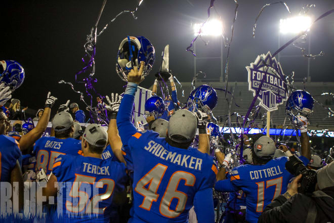 Players on the Boise State team celebrate their Mountain West Conference Championship win over Fresno State.