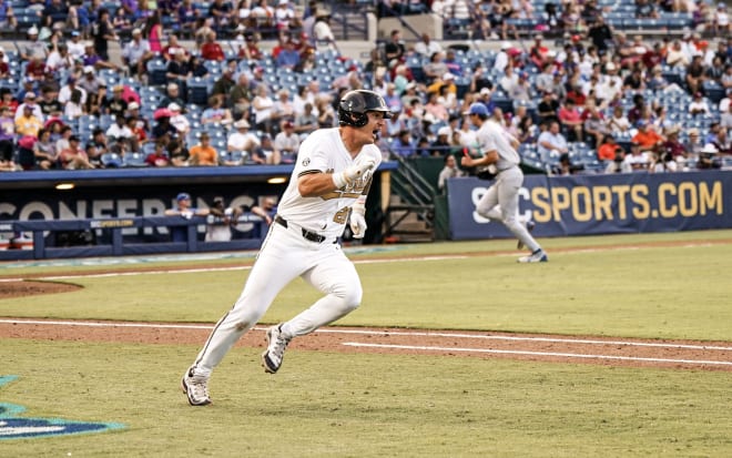 Vanderbilt's Braden Holcomb charges towards first on a fourth-inning single. 