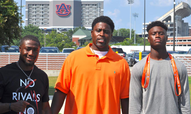 Chris Humes, George Pickens Sr. and George Pickens Jr. in Auburn on Friday.