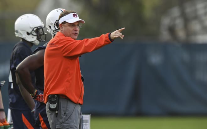 Gus Malzahn directs traffic at Auburn's first practice of the spring Tuesday.