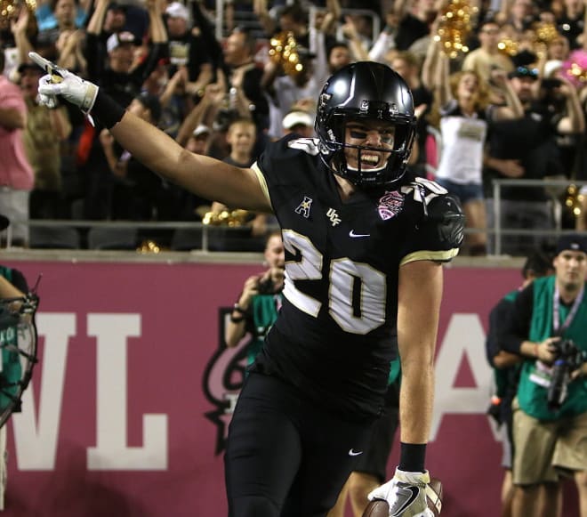 Taylor Oldham celebrates after catching his first career touchdown pass in last December's Cure Bowl, his final game.