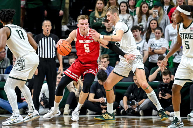 Michigan State's Carson Cooper guards Wisconsin's Tyler Wahl on Dec. 5, 2023, at the Breslin Center in East Lansing.