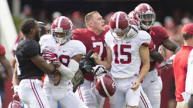 JK Scott (15) celebrates with teammates after kicking a gam-winning 30-yard kick during A-Day. Photo | Laura Chramer 