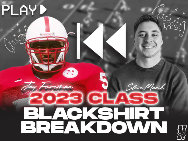 Jay Foreman (left) and Steve Marik break down game film of the Huskers' 2023 signees.