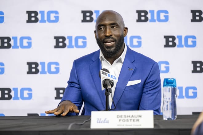 UCLA first-year head coach DeShaun Foster answers a question from reporters Wednesday during a side session at Big Ten Media Days at Lucas Oil Stadium in Indianapolis.