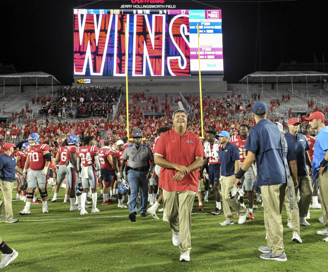 Ole Miss coach Matt Luke leaves the playing field following the Rebels' 31-17 win over Arkansas Saturday night in Oxford.