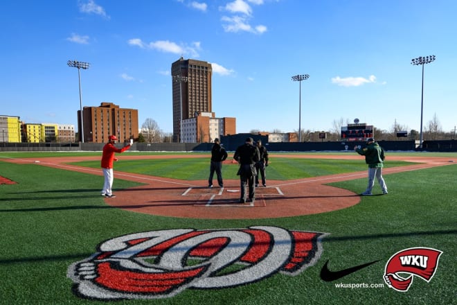 Head Coaches John Pawlowski and Tod Brown greet each other after delaying their opening series over the weekend. (Photo: wkusports.com)