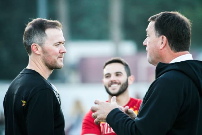 New USC football coach Lincoln Riley, left, with athletic director Mike Bohn and director of player personnel Spencer Harris (middle) at practice Tuesday.