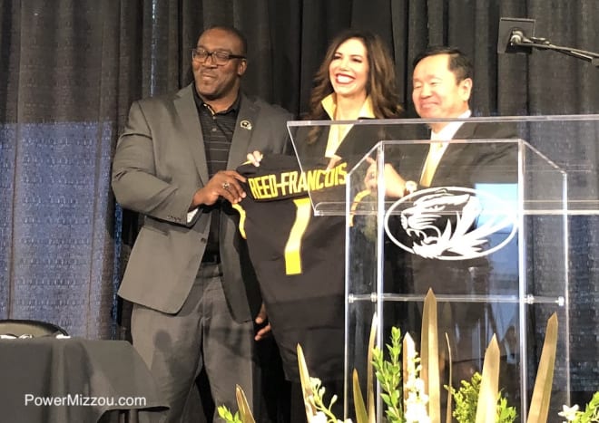 Reed-Francois poses for pictures with Board of Curators Chairman Darryl Chatman and University system President Mun Choi