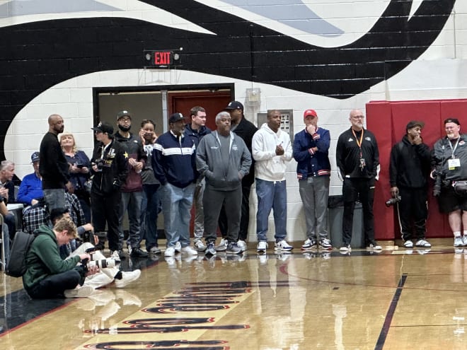 Arizona head coach Tommy Lloyd (back middle) and associated head coach Jack Murphy were in attendance for Carter Bryant's standout performance Tuesday in Southern California.