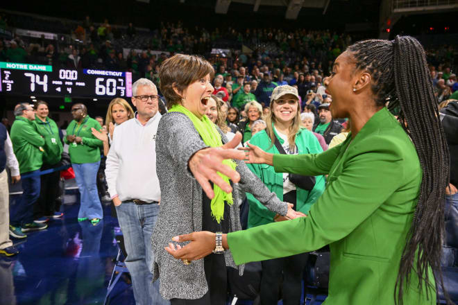 Former Notre Dame women's basketball head coach Muffet McGraw and current coach Niele Ivey celebrate after Ivey's Irish upended UConn on Dec. 4.