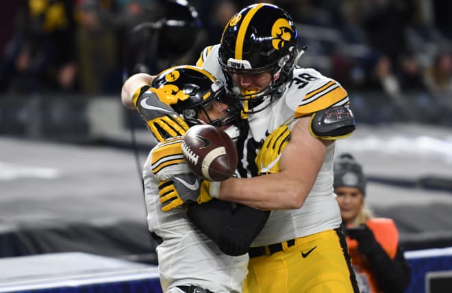 Noah Fant and T.J. Hockenson celebrate a touchdown in the 2017 Pinstripe Bowl.