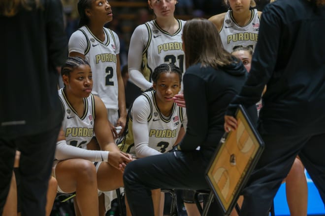 Purdue Boilermakers women s team listens to Head Coach Katie Gearlds during a timeout during the NCAA women's basketball game against the Quincy Hawks, on Sunday, Oct. 29, 2023, at Mackey Arena in West Lafayette, Ind.