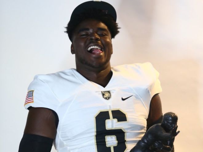 An elated Andre Miller after the 3-star DE commits to Army West Point on Saturday