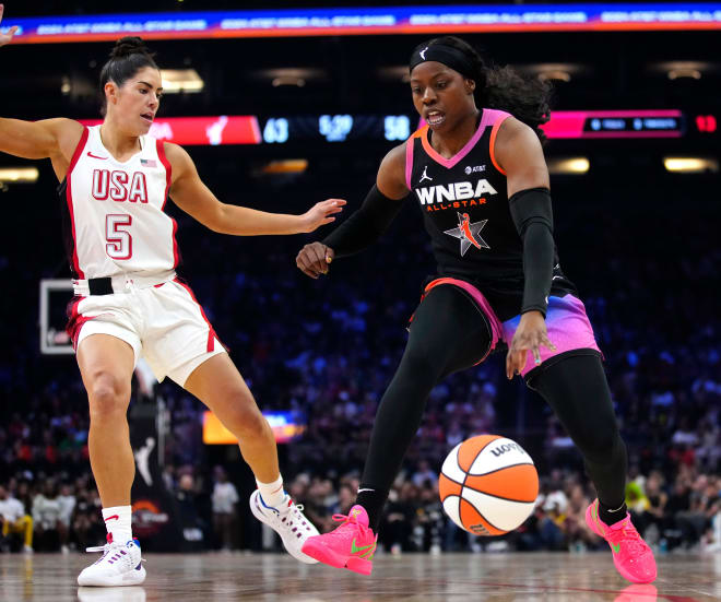 Team WNBA Arike Ogunbowale drives against Team USA's Kelsey Plum during the WNBA All-Star Game, Saturday night in Phoenix.