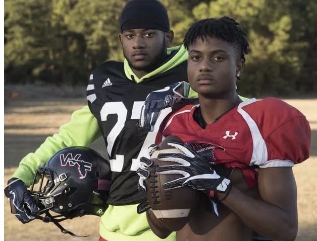 Keyshawn Helton (right) poses for a photo with fraternal twin brother Keyon during their time at West Florida High.