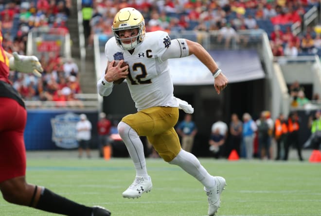 Notre Dame quarterback Ian Book running against Iowa State during the Camp World Bowl