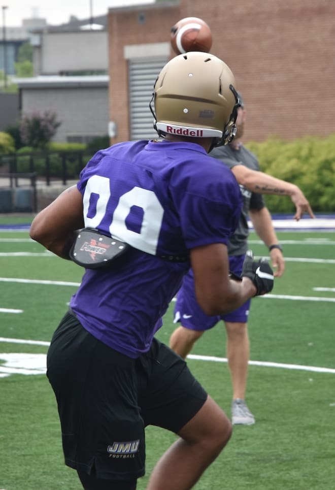 James Madison wide receiver Jake Brown turns to catch a pass during Dukes practice this past Monday at Bridgeforth Stadium.