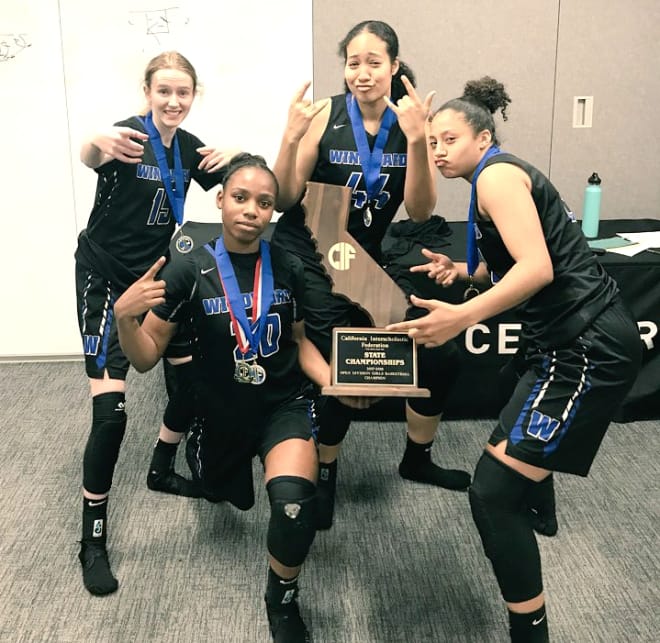 Kaiyah (far right) and Windward teammates after winning a State chip