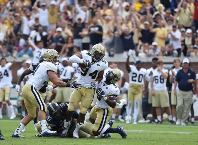 Brant Mitchell, Anree Saint-Amour and Vic Alexander celebrate after a Pitt fumble 
