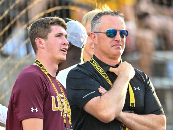 Ryan Fitzgerald speaks with his father, Pat on a visit to Iowa in the fall. 